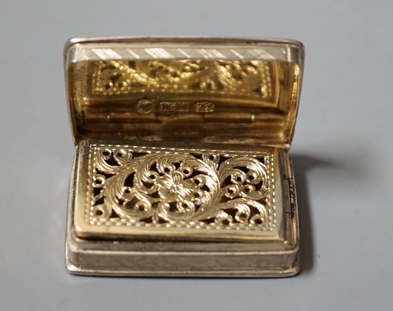 An early Victorian engraved silver rectangular vinaigrette, by Nathaniel Mills, Birmingham, 1839, 34mm.